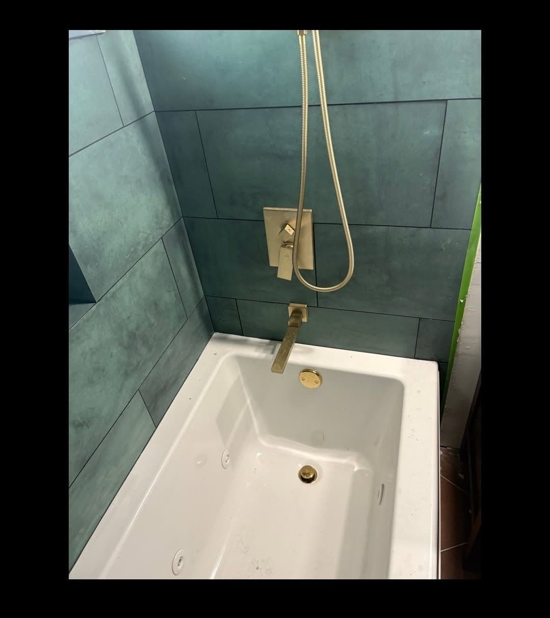 Sleek Bathroom Transformation with Gold Fixtures image